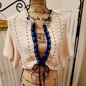 Gorgeous sweater ties in the front